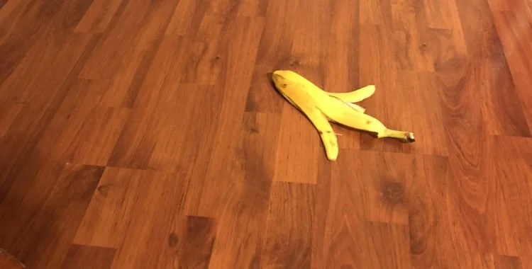 Banana peel left on floor.