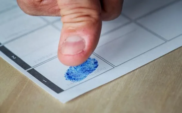 Man being fingerprinted. Criminal expungement in West Virginia.